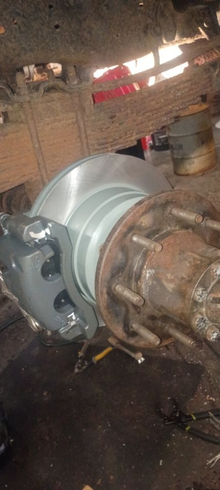 A new rotor and caliper bracket fitted